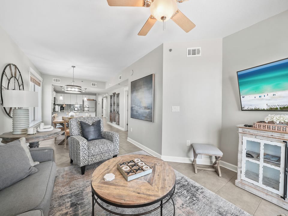 Relax in your bright, coastal living space with stylish furnishings and open layout connecting to the modern kitchen.