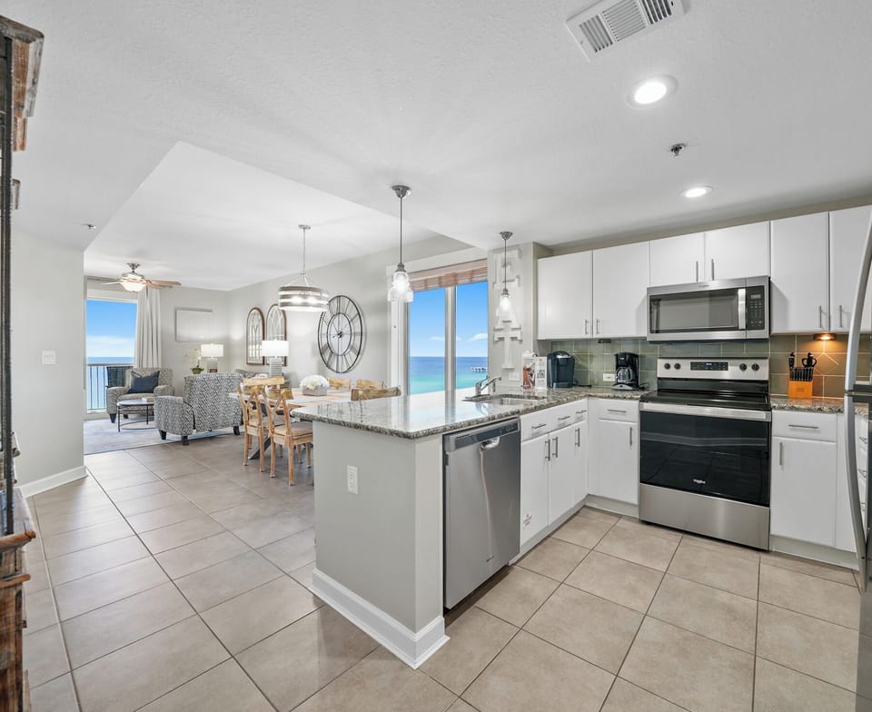 Your open-concept kitchen flows seamlessly into the living area, with stunning ocean views framing every meal you prepare.