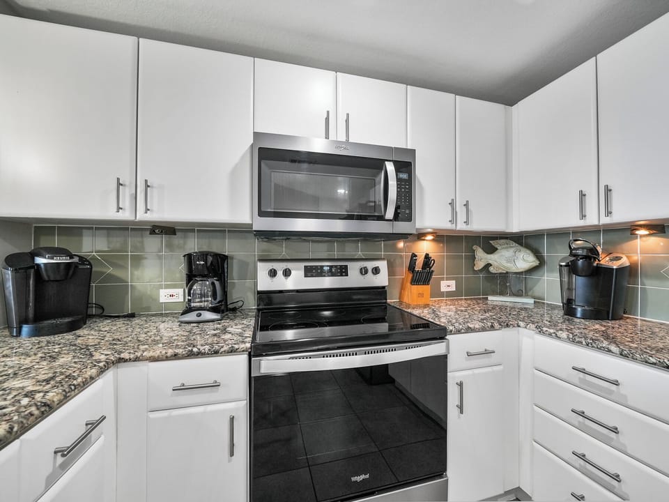 Your fully equipped kitchen awaits with granite counters, stainless appliances, and everything needed to create memorable meals during your stay.