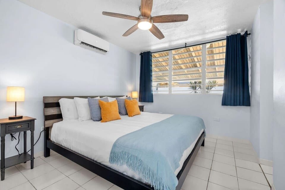 The master bedroom has a king bed, full body mirror, closet space and an ensuite bathroom.