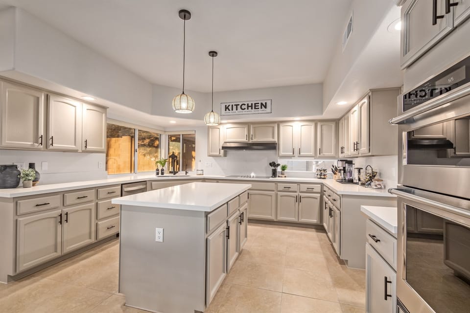 Gourmet kitchen with sleek quartz counters and ample natural light for culinary adventures!