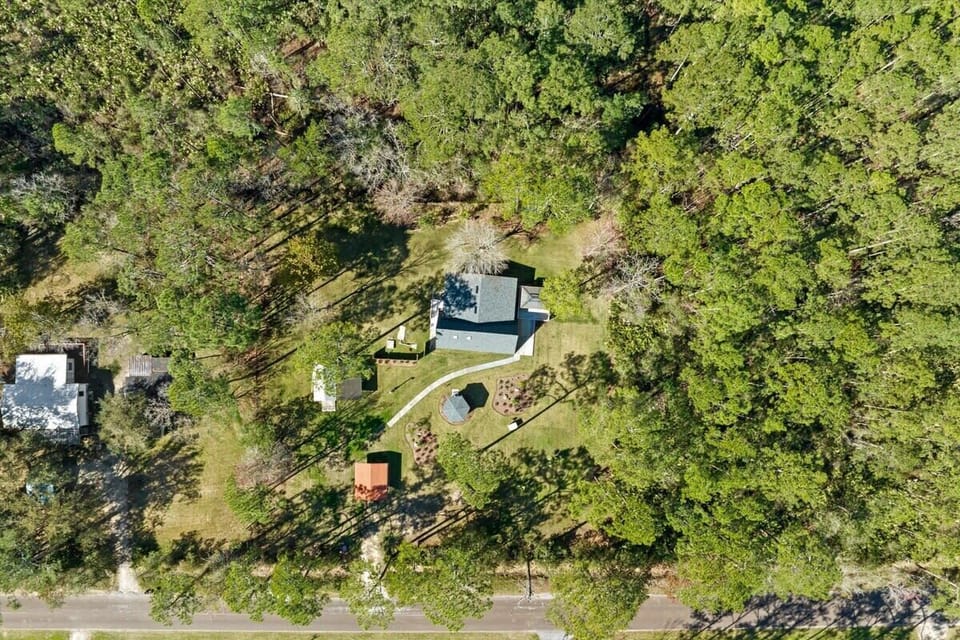 The home is on a traffic-free street and several pine trees in the privacy of the surrounding forest