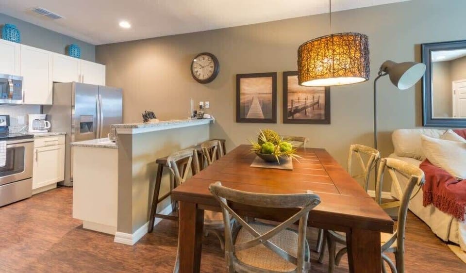 Dining table for 6 and kitchen area with breakfast bar. Perfect for dining at home!