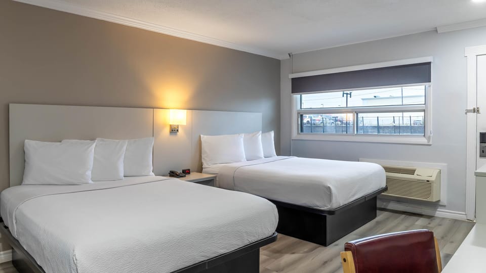 Deluxe Room, 2 Queen Beds, Non Smoking, Refrigerator & Microwave | Blackout drapes, soundproofing, iron/ironing board, free WiFi