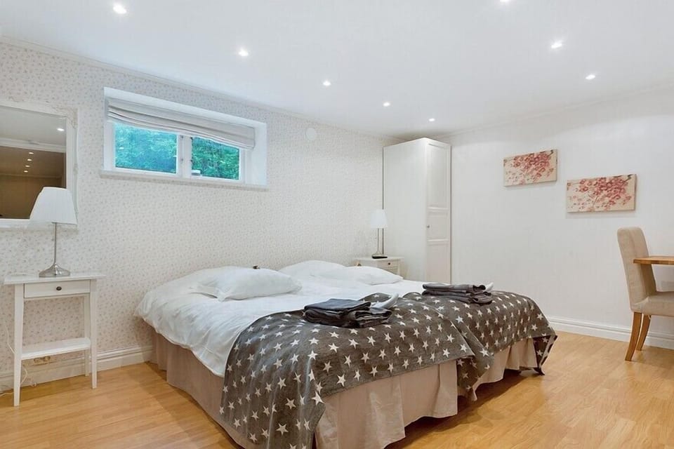 Twin Room, Shared Bathroom | Desk, laptop workspace, blackout drapes, iron/ironing board