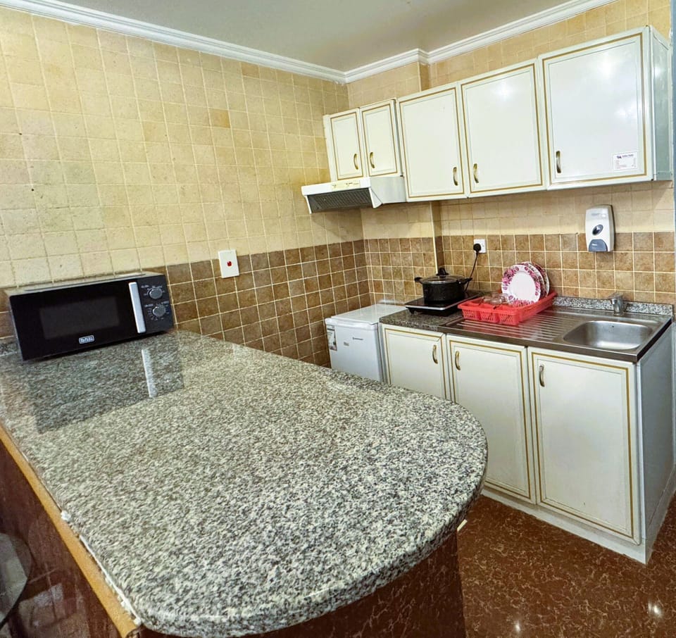 Triple Studio Apartment | Private kitchen | Fridge, stovetop, electric kettle, cookware/dishes/utensils