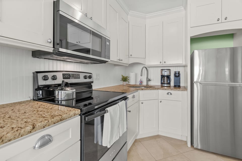 Your fully equipped kitchen features granite counters, stainless steel appliances, and everything you need to create memorable meals during your stay.