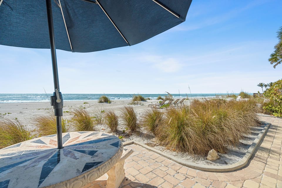 Your private beachfront terrace awaits, with soft sand just steps away and gentle waves beckoning for endless seaside relaxation.