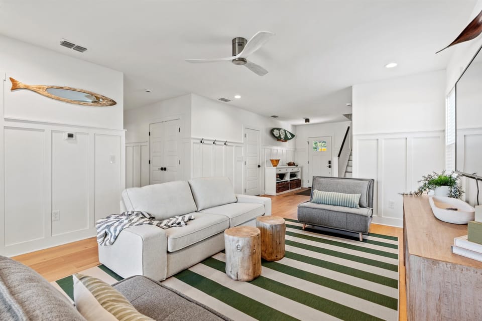 1st floor living room with 2 foldout twin beds and sliding door to the backyard. (1)