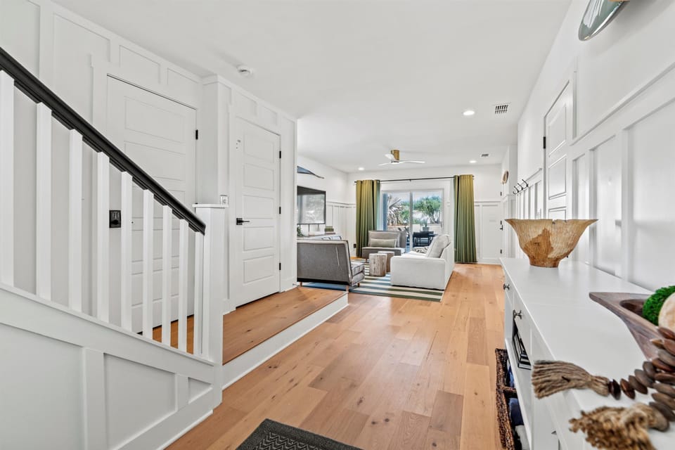 Foyer showing1st floor elevator access. garage access and living room.