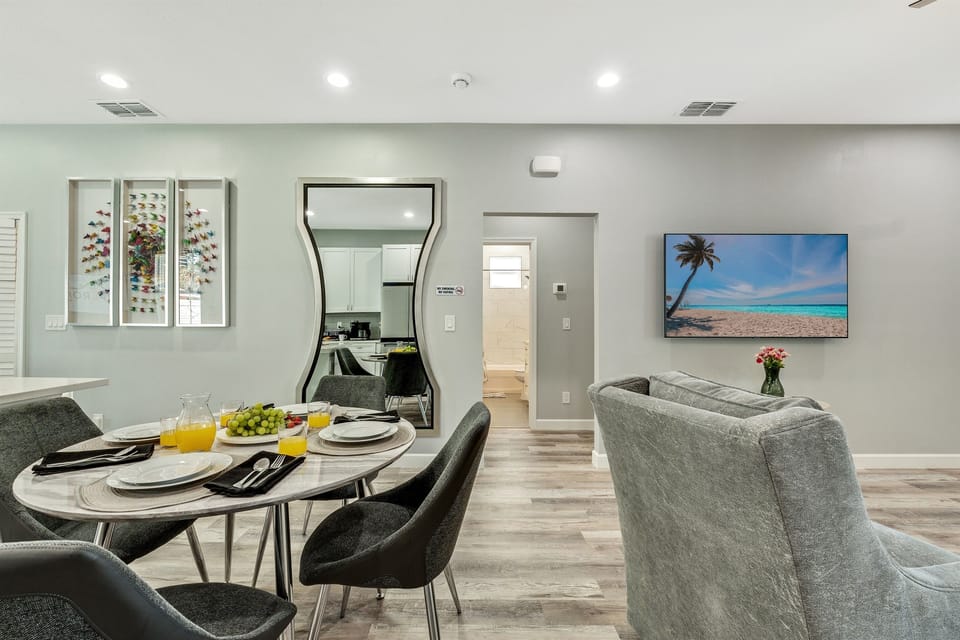 The dining room is a study in understated sophistication, with minimalist design elements that allow the beauty of the space to speak for itself.