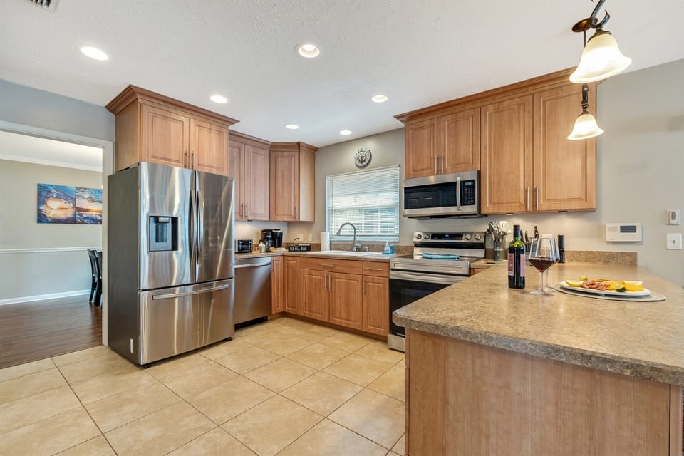 At the heart of this kitchen lies a mesmerizing display of cutting-edge appliances, meticulously curated to elevate your cooking experience to new heights.