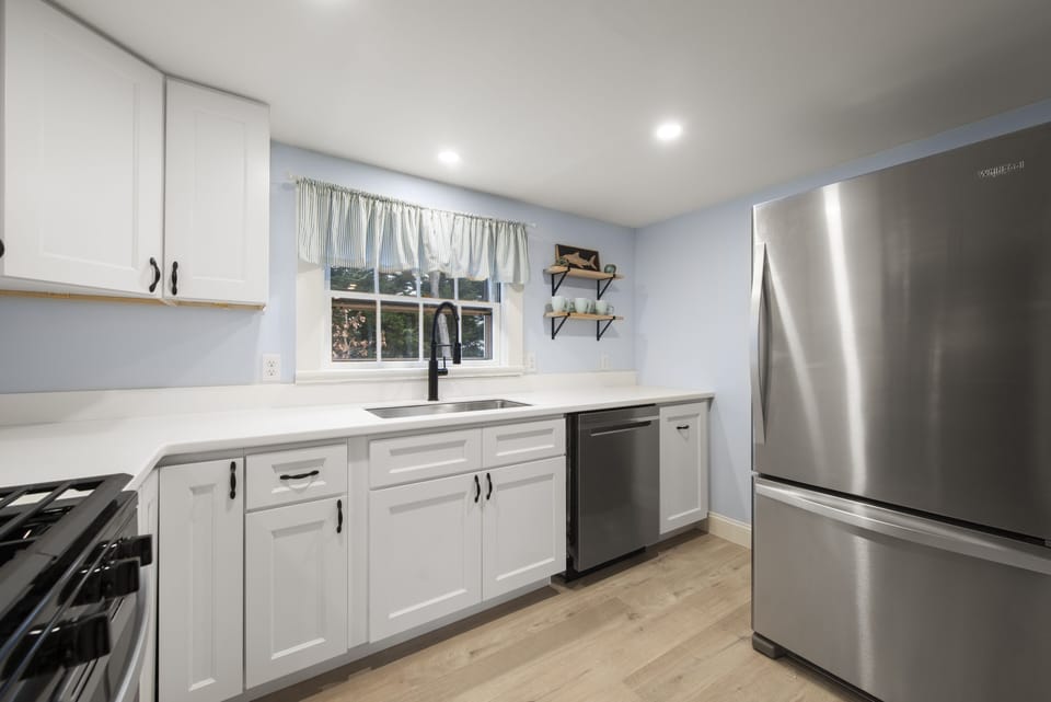 Fully renovated kitchen with brand new stainless steel appliances. 