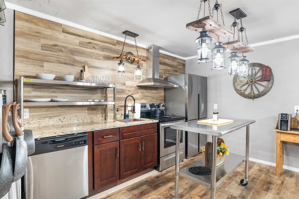 Brand-new appliances and plenty of cookware, dining ware, and utensils round out the well-appointed kitchen in the Rustic Suite!