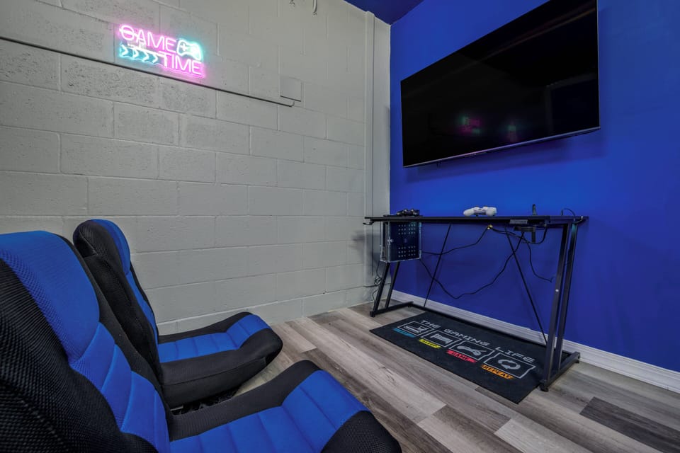 Converted garage featuring a pool table, air hockey table, and foosball table