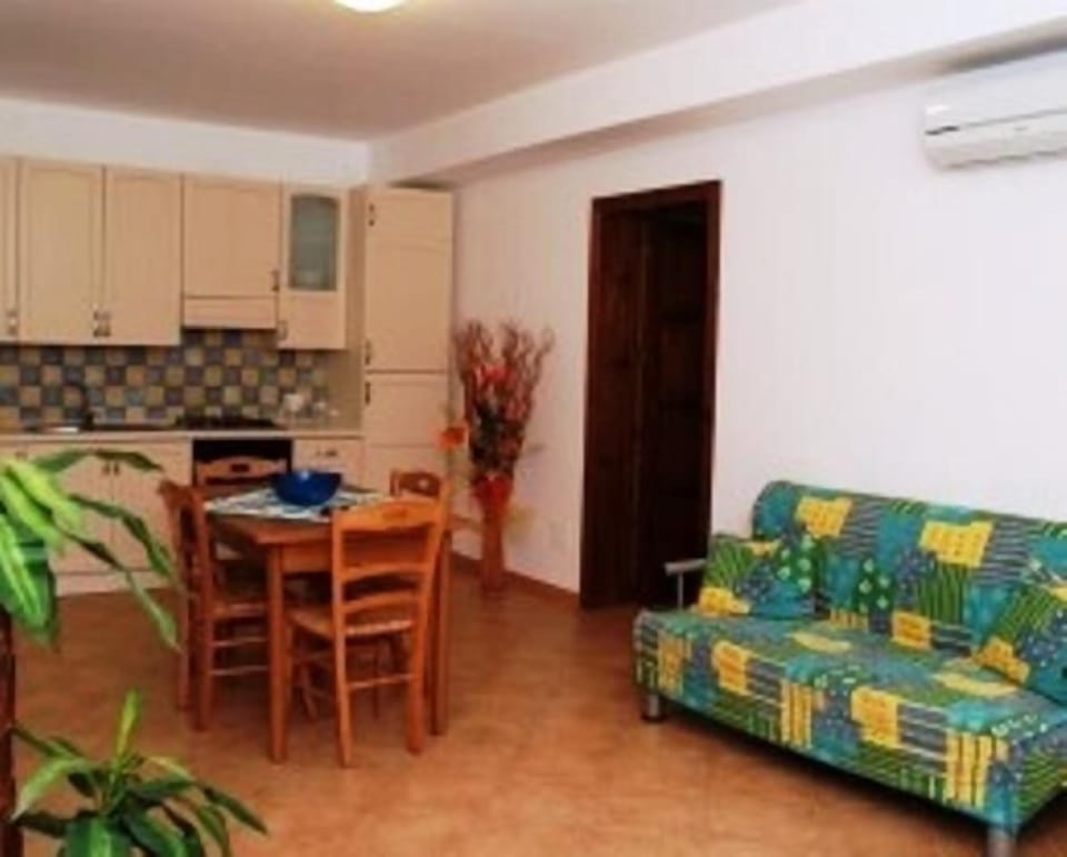 Apartment, 1 Bedroom | Living room | 26-inch TV with cable channels