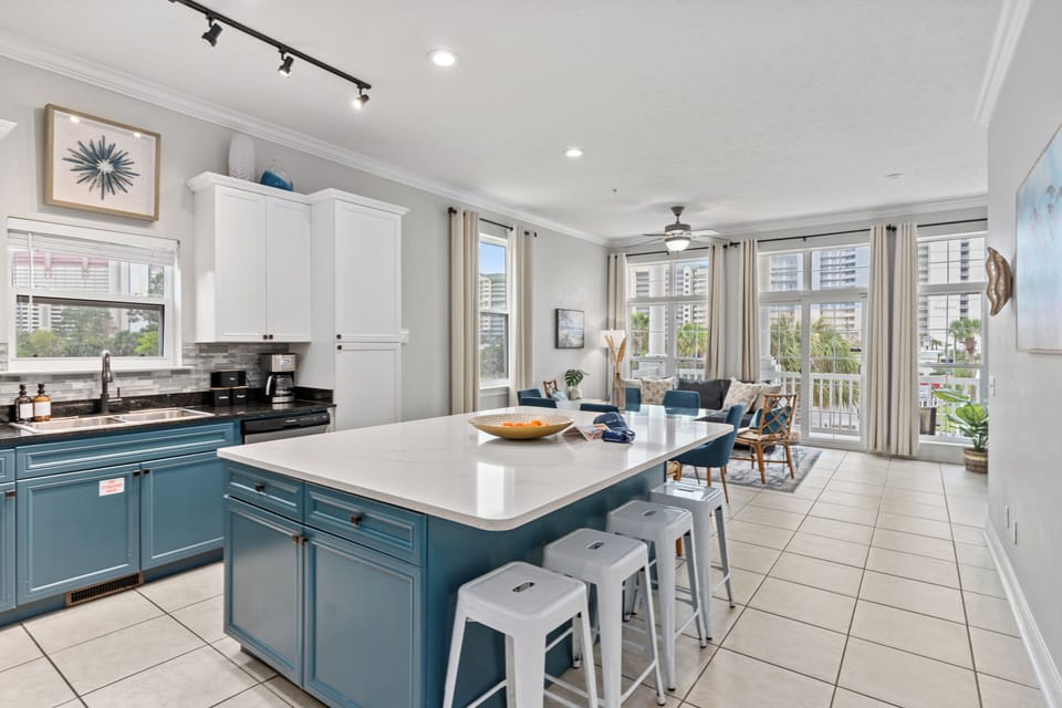 Fully equipped kitchen with barstool seating.