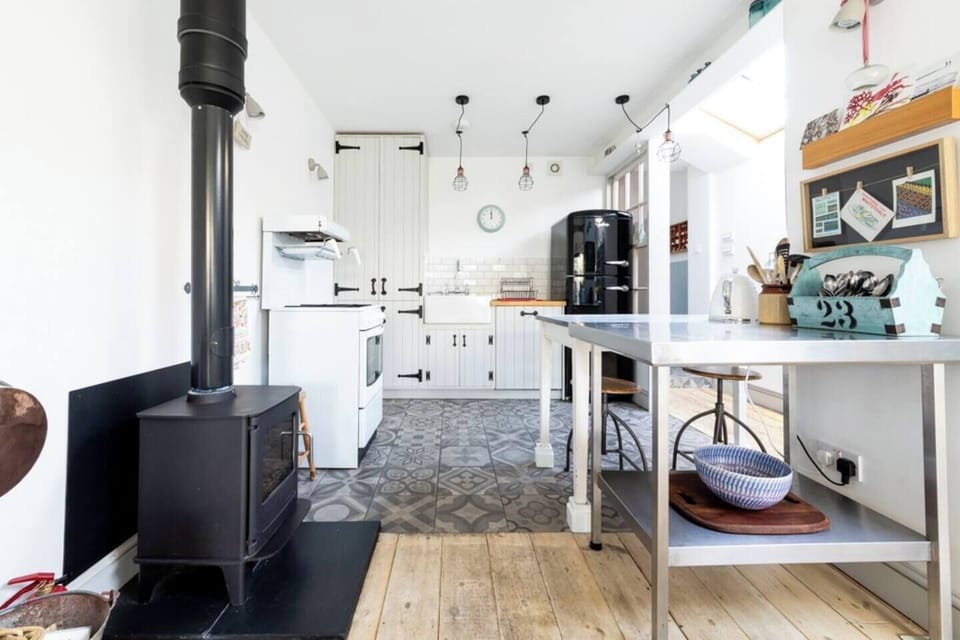 Fully equipped kitchen with log burner