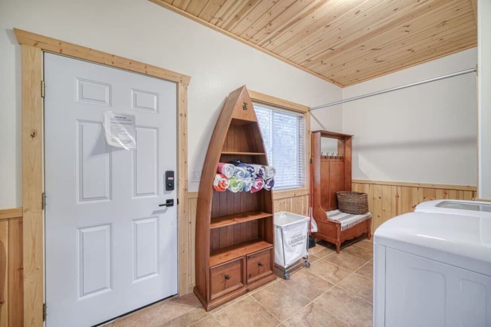 Laundry Room with bench and storage
