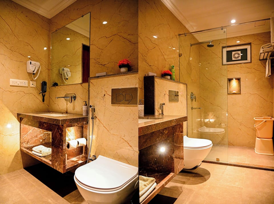 Executive Room | Bathroom | Shower, hair dryer, towels, soap
