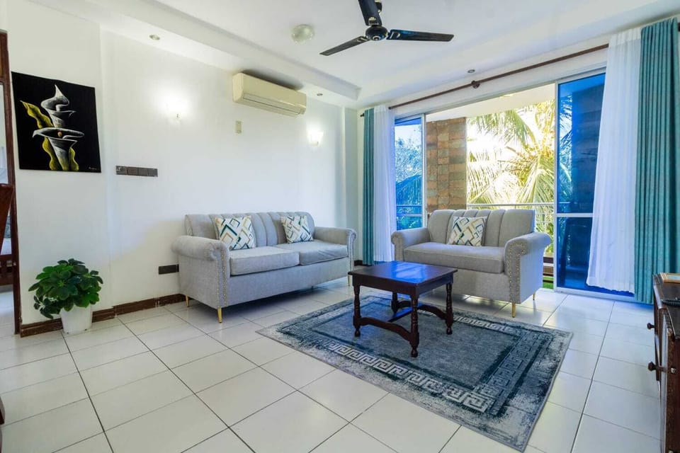 Comfort Apartment | Living area | 24-inch TV with digital channels
