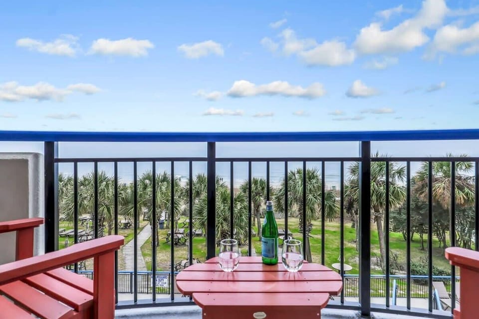 Morning coffee or sunset sips? Your private balcony has front-row seats to palm-lined paths, ocean breezes, and serious vacation vibes—cheers to making memories with a view! 