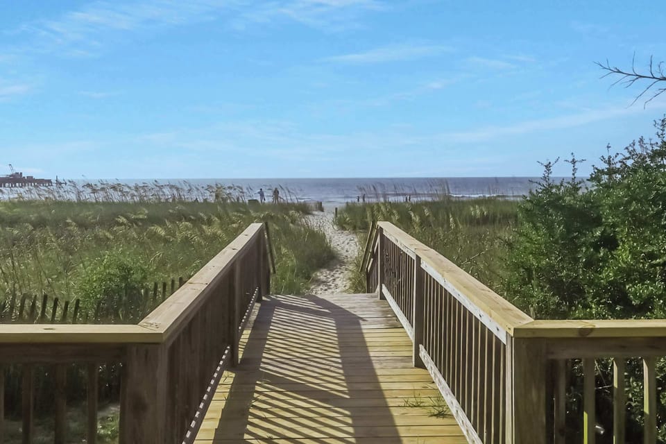Step onto the private boardwalk and let your toes meet the sand in seconds. Your beachfront escape starts here—sun, sea, and serenity await!
