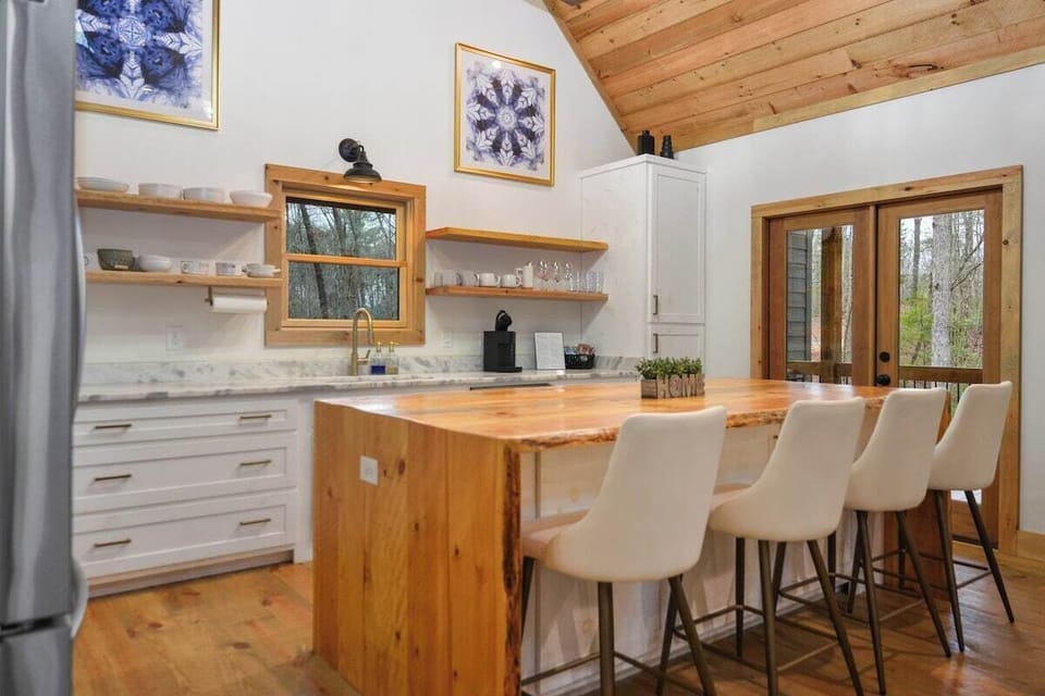 The kitchen island and chairs.