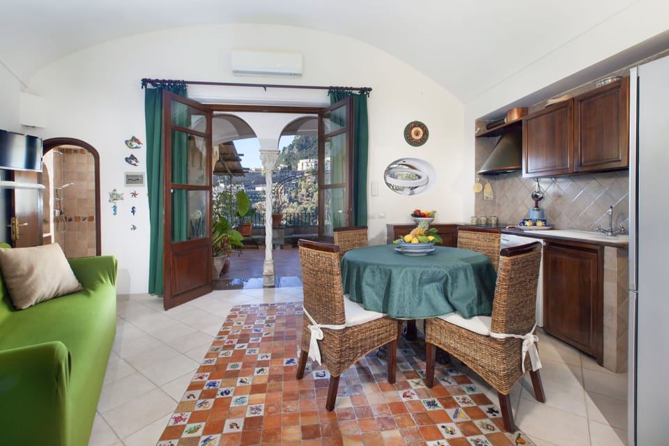 Apartment, Terrace, City View | Living area | 32-inch flat-screen TV with digital channels