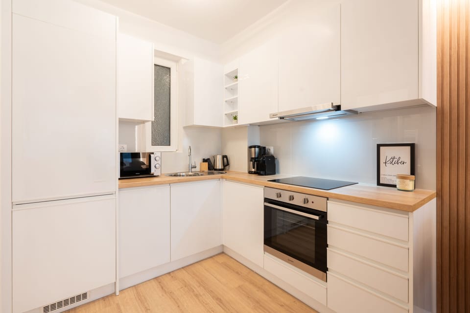 Design Apartment | Private kitchen | Full-size fridge, microwave, oven, stovetop