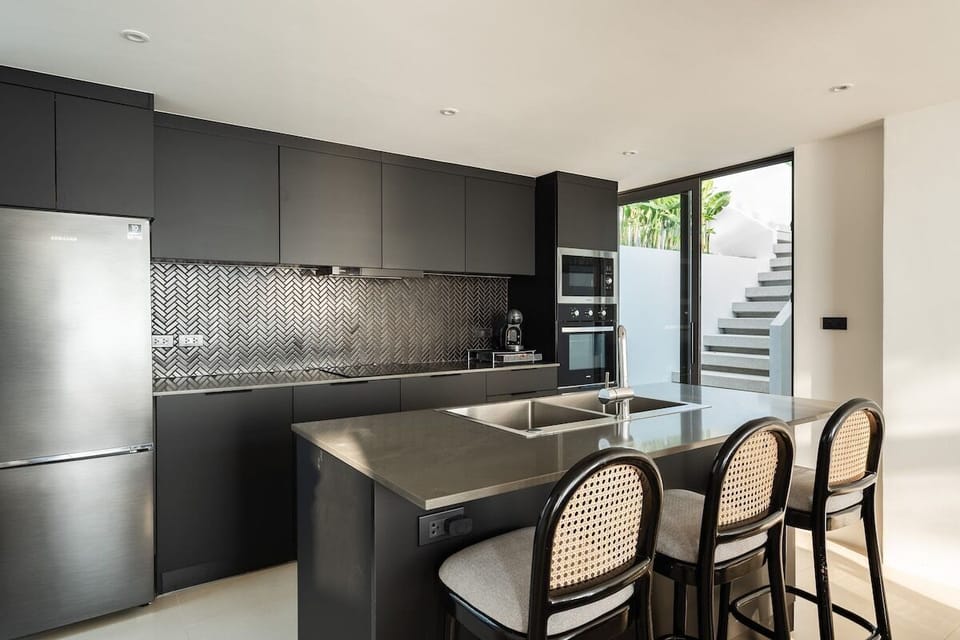 Modern meets gourmet – our kitchen is a chef's dream with state-of-the-art Häfele appliances, a Nescafe Dolce Gusto machine, and a touch of elegance.