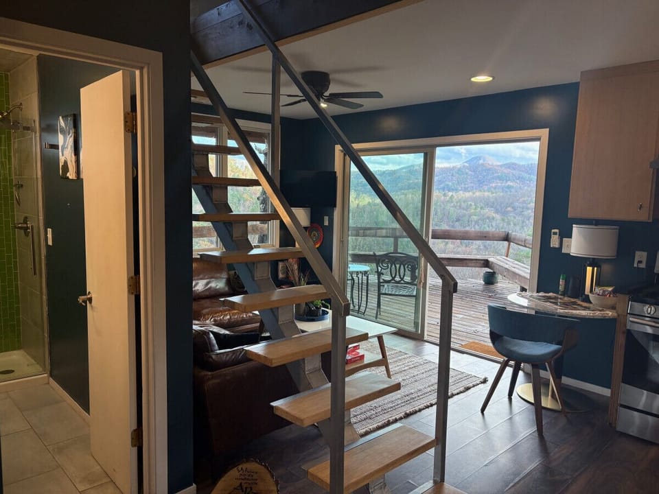 Custom staircase leads to incredible loft bedroom