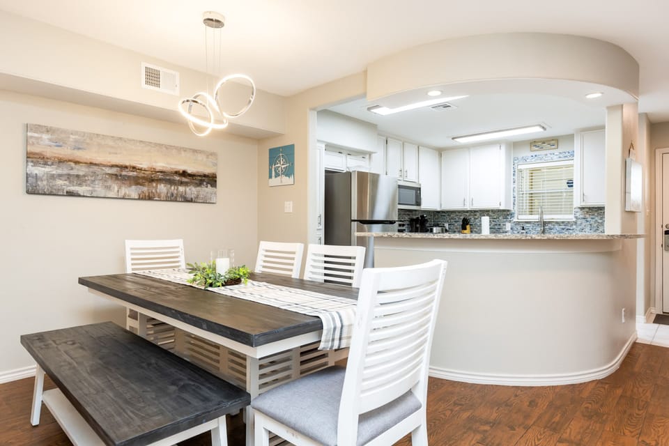 Your spacious dining area flows seamlessly into a modern kitchen, creating the perfect space for memorable meals together.