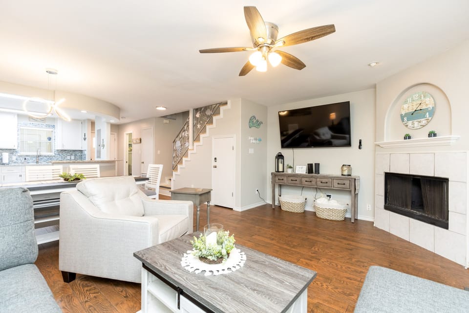 Unwind in your spacious living area with soaring ceilings, cozy fireplace, and modern amenities creating the perfect home-away-from-home retreat.