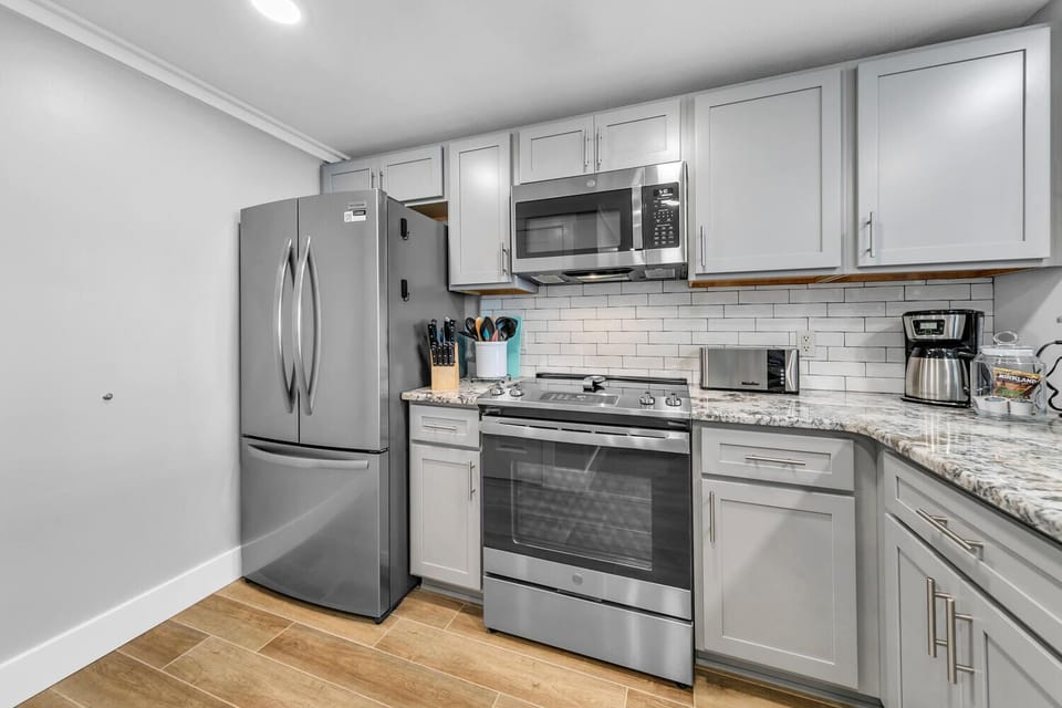 Your fully equipped kitchen features stainless steel appliances and granite counters, perfect for preparing meals during your stay.