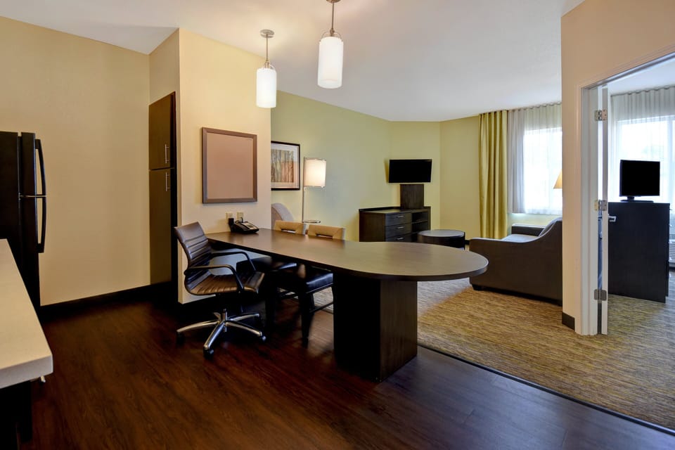 Desk, laptop workspace, blackout drapes, iron/ironing board