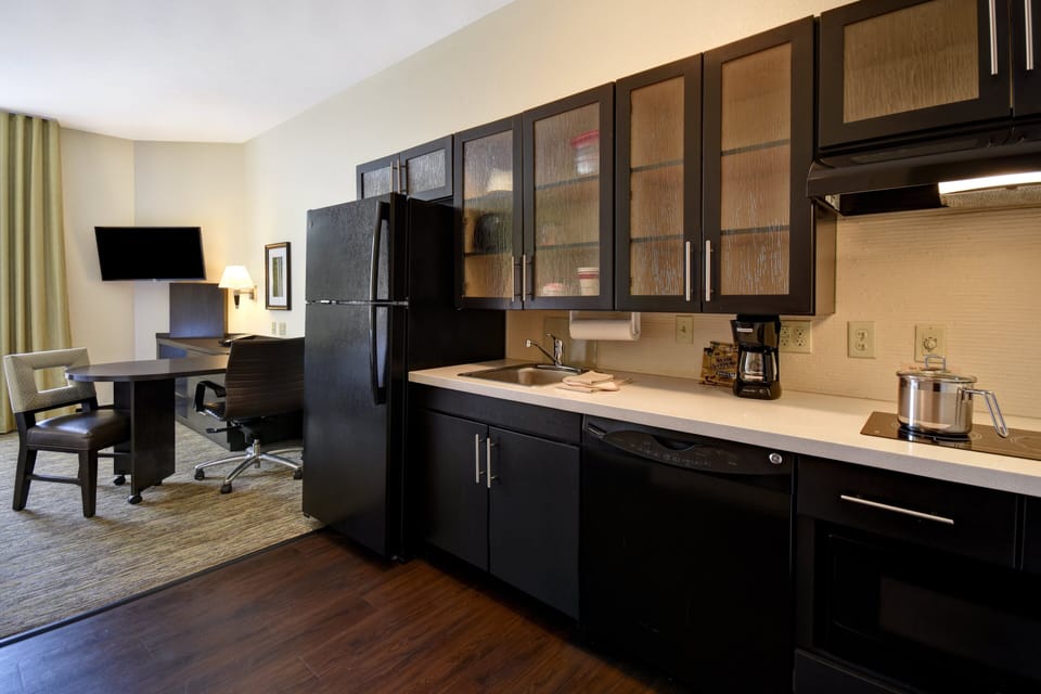 Desk, laptop workspace, blackout drapes, iron/ironing board