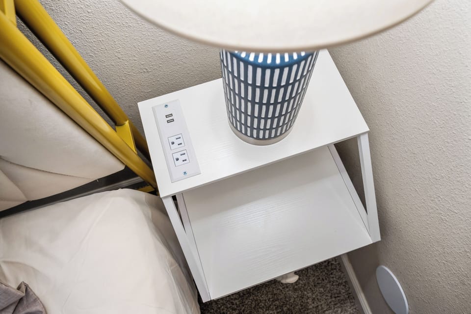Easily charge your devices with an outlet near the bed.