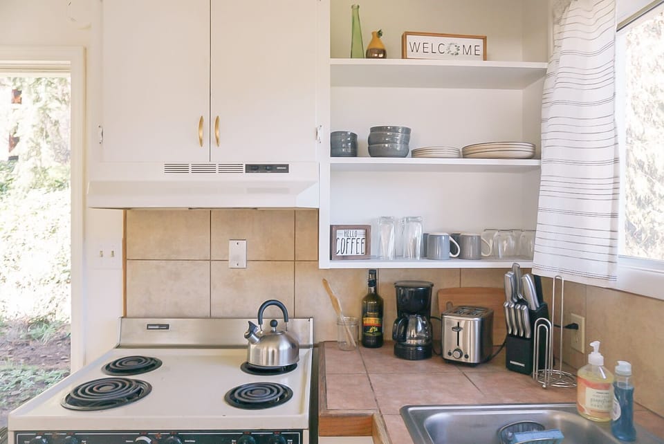 Kitchen is fully equipped with essential cooking utensils. 