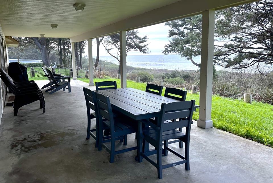 Oceanfront bliss on the patio! Dining, BBQ, lounge chairs await with ocean views