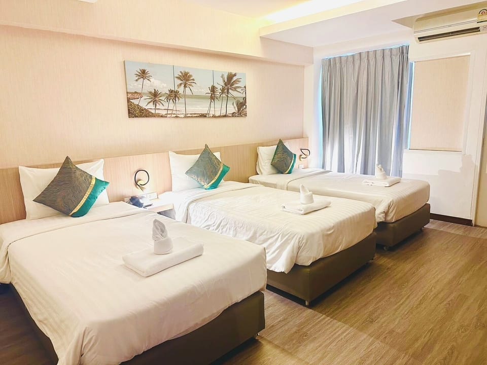 Comfort Triple Room, City View | Desk, laptop workspace, free WiFi, bed sheets