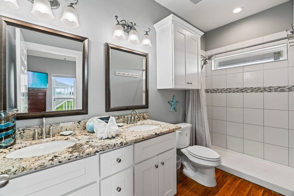 Light and bright bathroom with a beautiful shower.