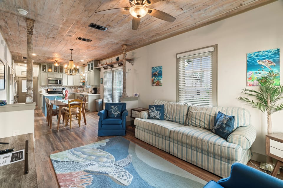Living Room w/ Open Floor Plan to Dining Table & Kitchen