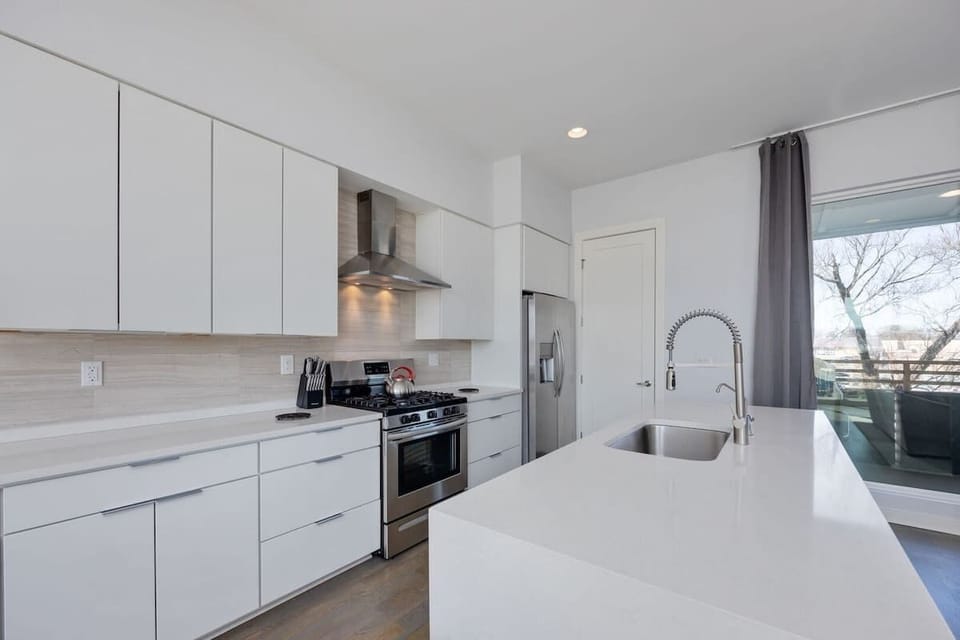 Fully equipped kitchen stocked with your basic cooking essentials, stainless-steel appliances, and breakfast bar seating. (2nd Floor)