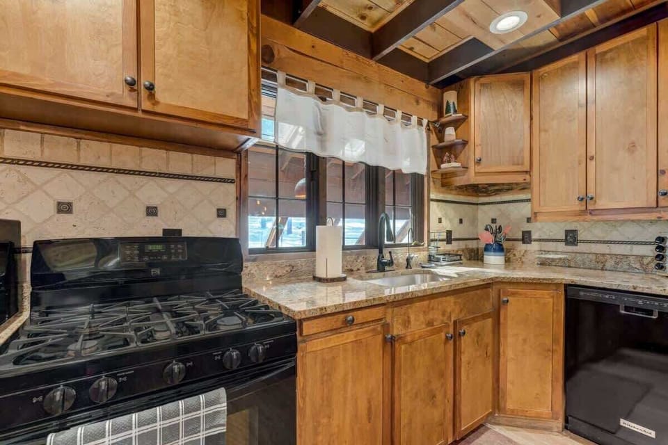 The kitchen's culinary command center - the stove, the heart of every meal. With plenty of cabinetry for storage and organization, it's a chef's dream come true.