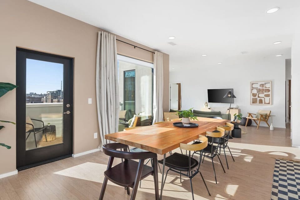 Enjoy your coffee and breakfast around the dining table with seating for 8, or step out to the patio to enjoy some sunshine. We get lots of natural light in the space as this is the top floor penthouse unit.