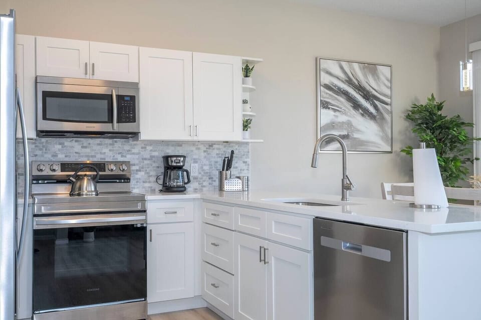 Fall in love for modern luxury with our stunning open kitchen—a beautiful, vibrant space that seamlessly combines style and functionality. a family-friendly retreat where the joy of cooking meets the warmth of togetherness.
