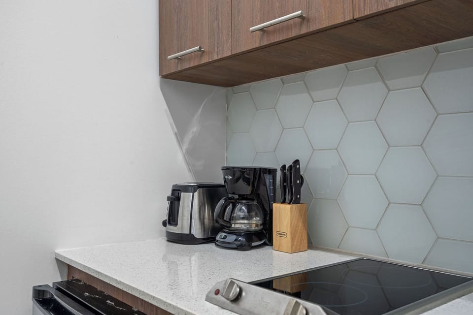 Prepare your favorite meals in the convenient kitchenette, equipped with a mini fridge, microwave, and two-burner stove.