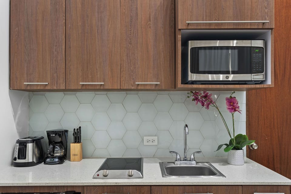 It is a small but fully equipped kitchenette perfect for preparing simple meals on your extended stay.
