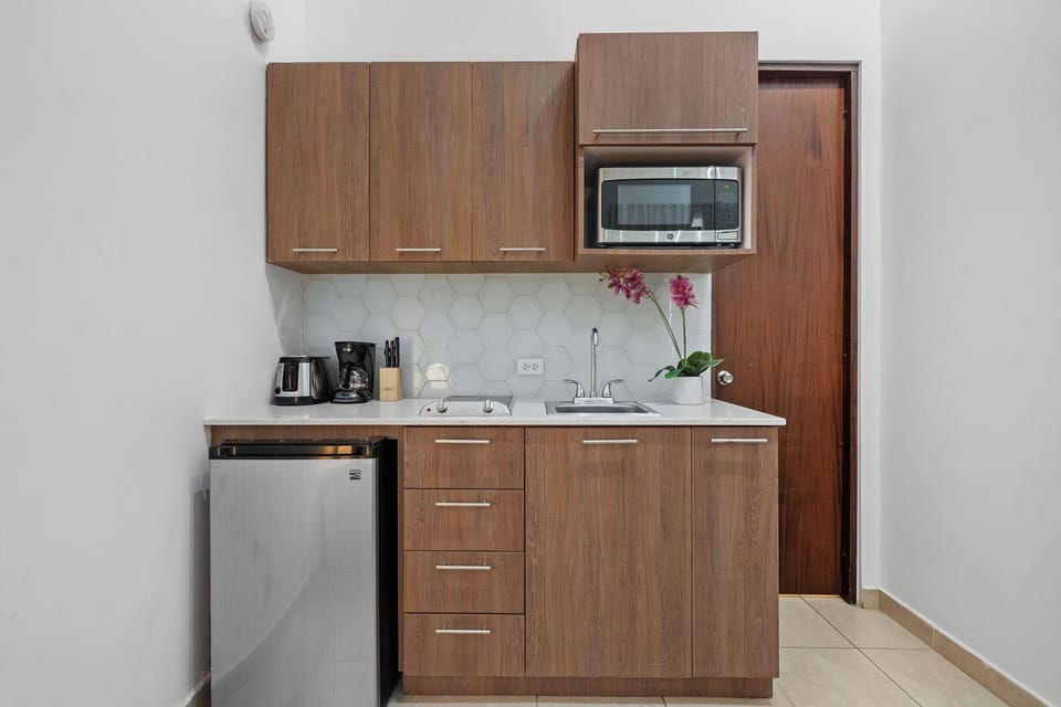 Prepare your favorite meals in the convenient kitchenette, equipped with a mini fridge, microwave, and two-burner stove.